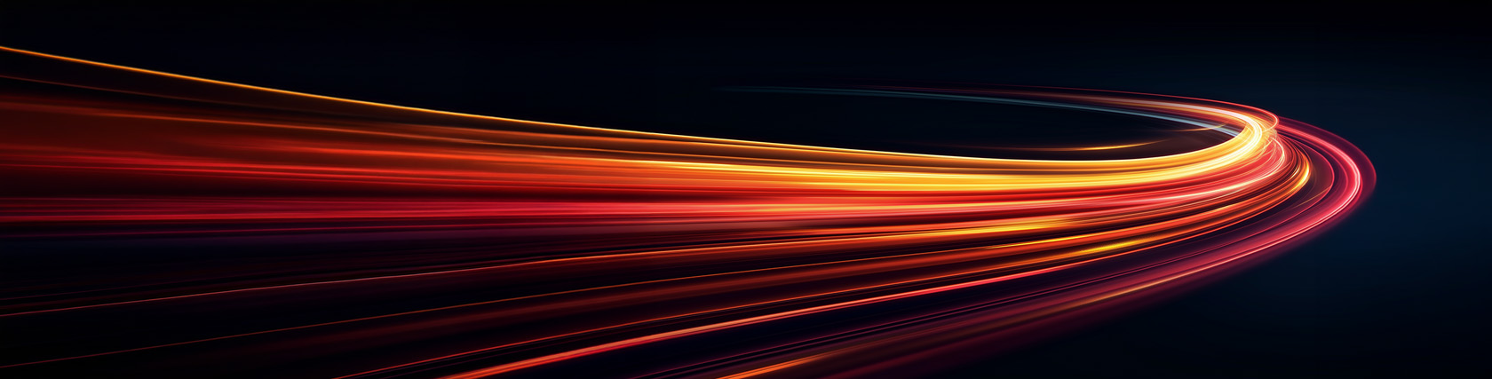 Curving light trails in shades of orange and red against a dark background, symbolizing speed, movement, and data flow.